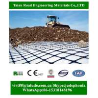 Composite geogrid for basal reinforcement of embankments